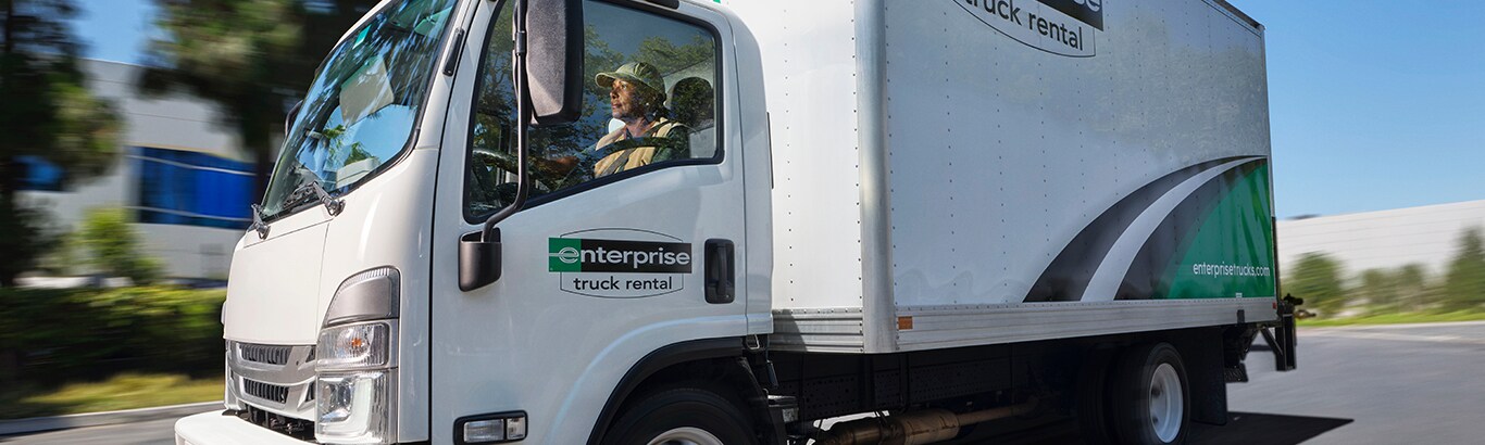 Employees loading an Enterprise Rental Truck