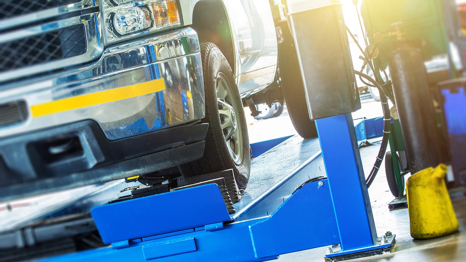 Closeup picture of a truck in a maintenance shop